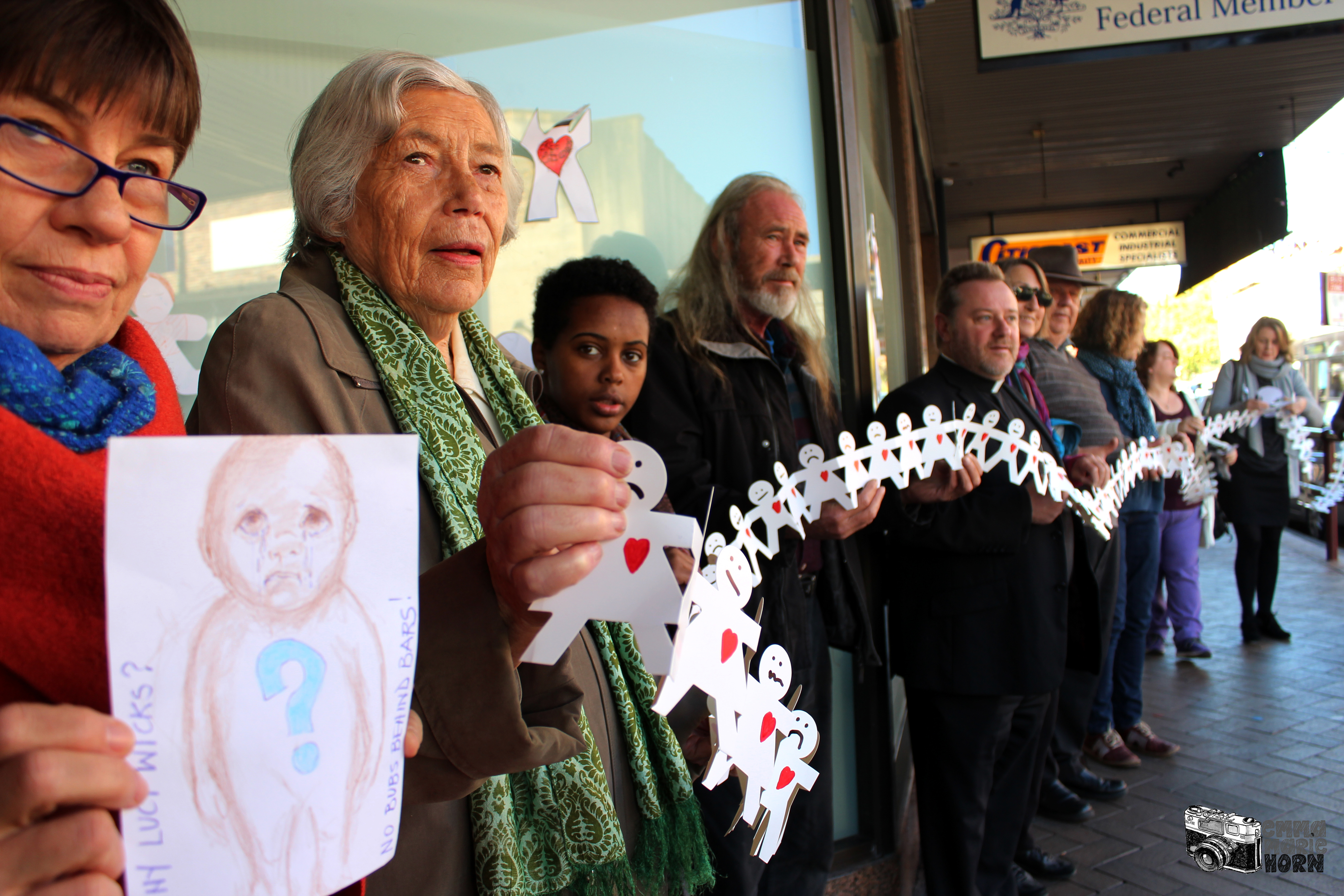 Protesters in front of the Gosford office of M.P. Lucy Wicks