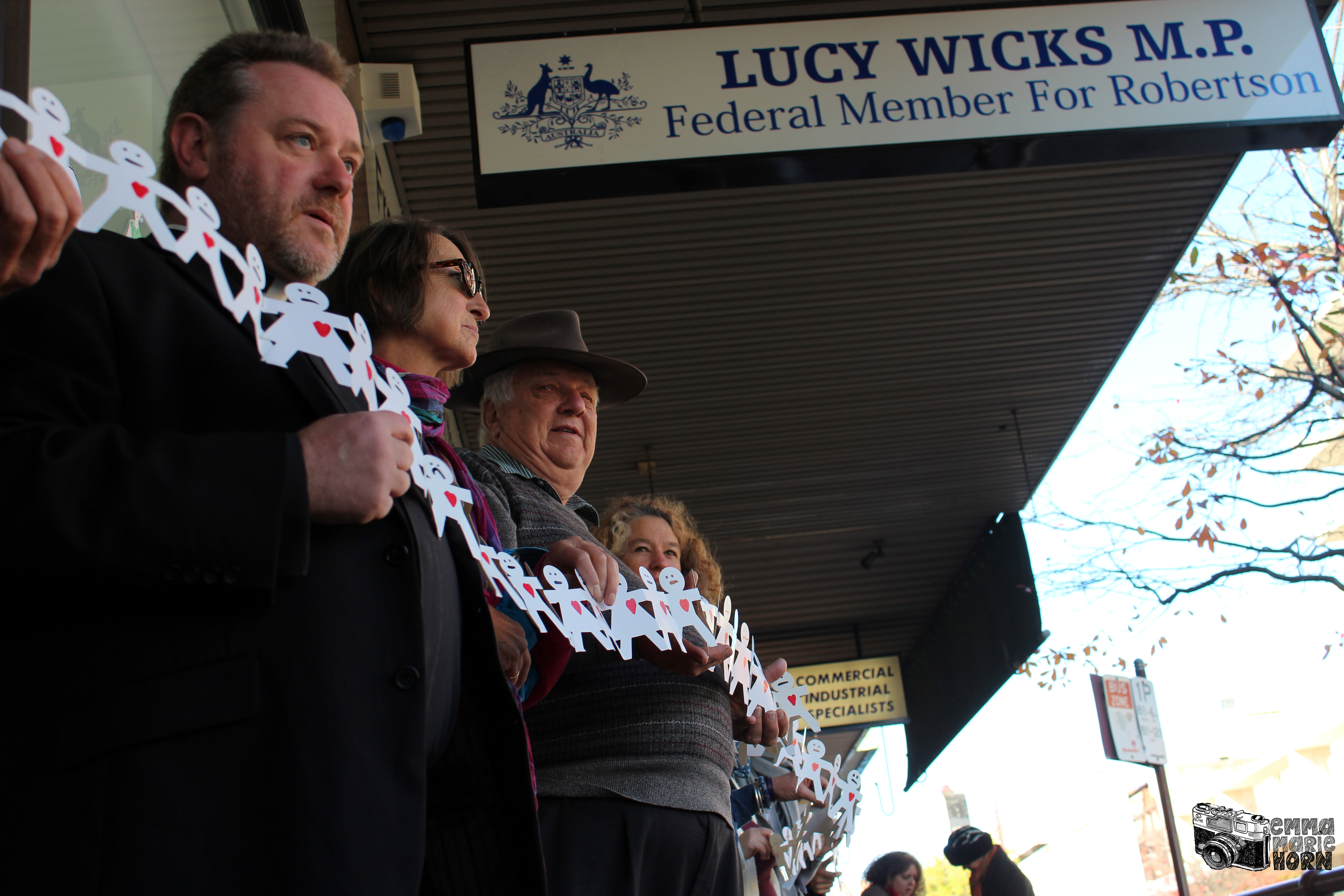 Father Rob Bower in front of the Gosford office of M.P. Lucy Wicks