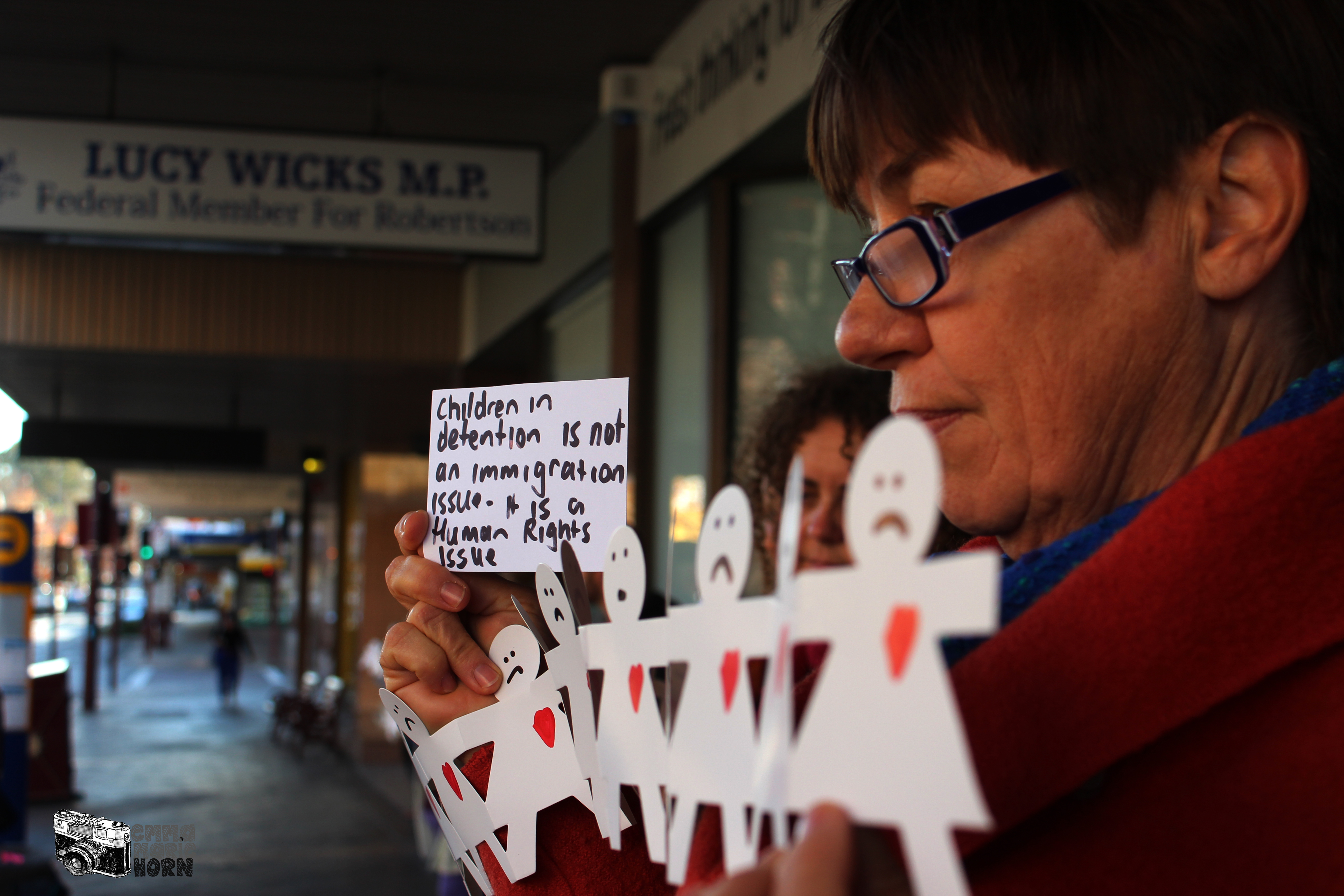 Protesters in front of the Gosford office of M.P. Lucy Wicks
